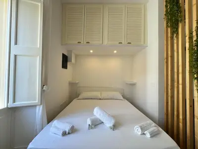 Letto o letti in una camera di Studio 27, Centro, Cagliari, Sardinia