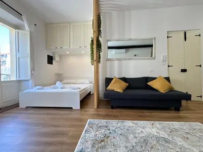 Letto o letti in una camera di Studio 27, Centro, Cagliari, Sardinia
