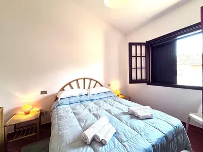 Letto o letti in una camera di Cozy Flow, Quartu Sant'Elena, Cagliari, Sardegna