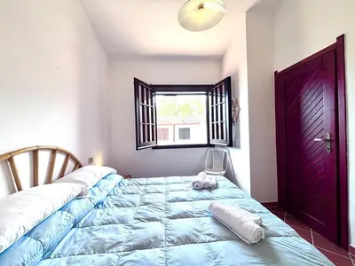 Letto o letti in una camera di Cozy Flow, Quartu Sant'Elena, Cagliari, Sardegna