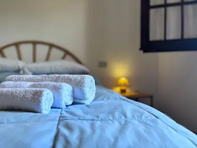 Letto o letti in una camera di Cozy Flow, Quartu Sant'Elena, Cagliari, Sardegna