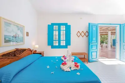 Letto o letti in una camera di Agriturismo Costa del Sud