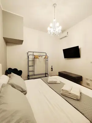 Letto o letti in una camera di Regina House al centro di Cagliari