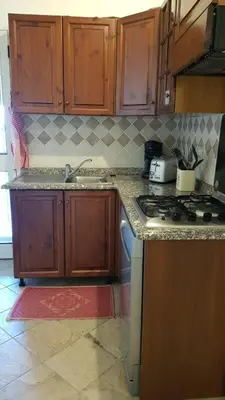 Cucina o angolo cottura di House 10' from the sea, AC, garden, parking, wifi