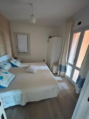 Letto o letti in una camera di Baia del Corsaro - new sea panoramic villa in Sardinia, Italy - 250 mt beach&sea full comfort-WiFi-Parking-Privacy