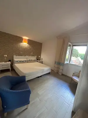 Letto o letti in una camera di Baia del Corsaro - new sea panoramic villa in Sardinia, Italy - 250 mt beach&sea full comfort-WiFi-Parking-Privacy