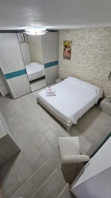 Letto o letti in una camera di Calasetta, casa vista mare