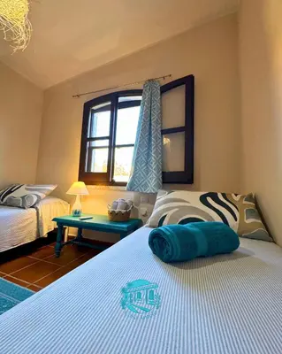 Letto o letti in una camera di Casa Antele