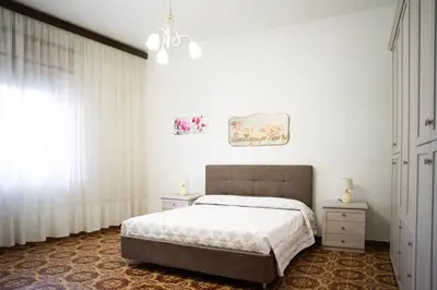 Letto o letti in una camera di Casa L'Iris