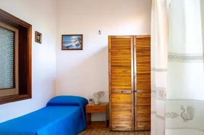 Letto o letti in una camera di Casa L'Iris