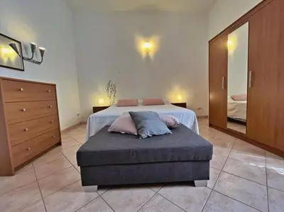 Letto o letti in una camera di La Maison