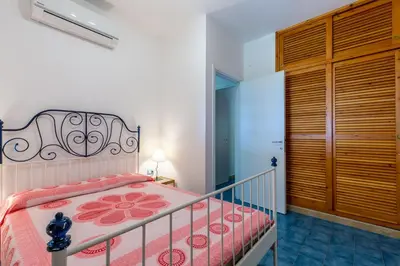 Letto o letti in una camera di Villa Cala Pira sul mare con Wi-Fi