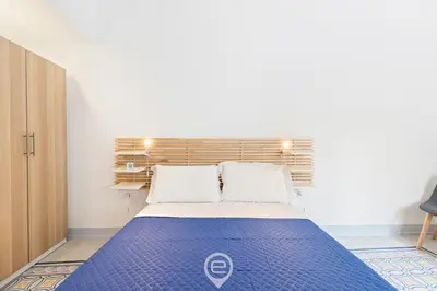 Letto o letti in una camera di Rosa dei Venti Guesthouse