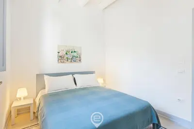 Letto o letti in una camera di Rosa dei Venti Guesthouse
