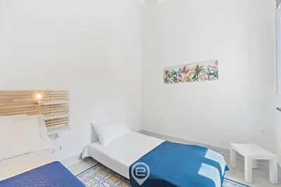 Letto o letti in una camera di Rosa dei Venti Guesthouse