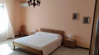 Letto o letti in una camera di Cora Manna casa vacanze