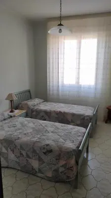 Letto o letti in una camera di Cora Manna casa vacanze