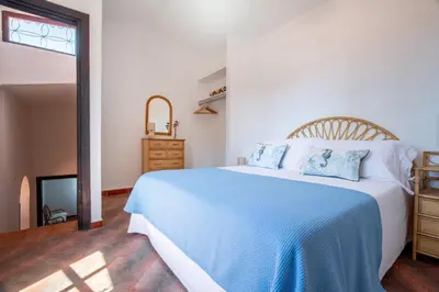 Letto o letti in una camera di Villa Lentischio a pochi passi dal mare cristallino di Solanas