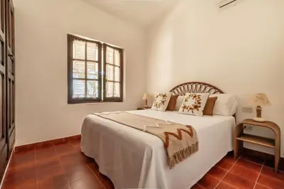 Letto o letti in una camera di Villa Lentischio a pochi passi dal mare cristallino di Solanas