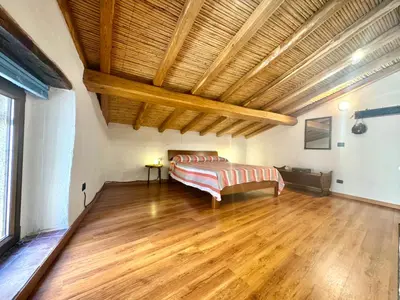 Letto o letti in una camera di Casa Monte Grappa