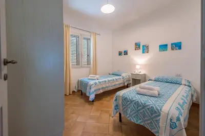 Letto o letti in una camera di Il Mirto - Affitti Brevi Italia