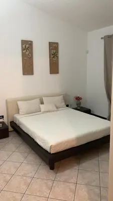 Letto o letti in una camera di Villa Emma