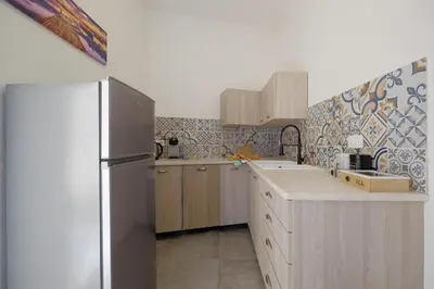 Cucina o angolo cottura di AquaBlue affittacamere by Teuladaapartments