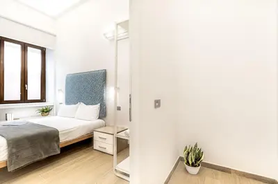 Letto o letti in una camera di Artis Rooms Guesthouse