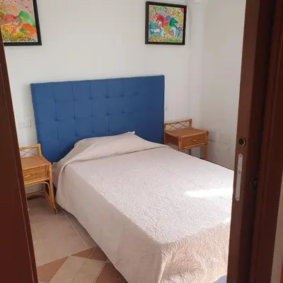 Letto o letti in una camera di Villa Basoru