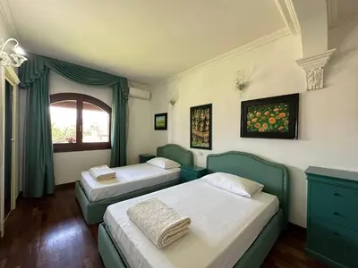 Letto o letti in una camera di Villa Basoru