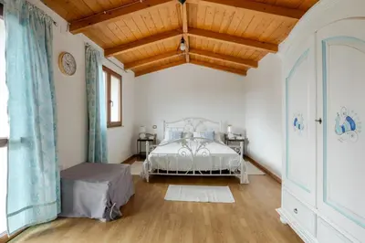Letto o letti in una camera di VILLA WITH GARDEN, San Sperate
