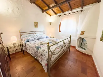 Letto o letti in una camera di Villa dei Pirati, sulla spiaggia di Campus