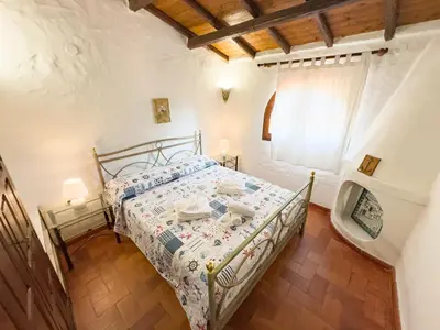 Letto o letti in una camera di Villa dei Pirati, sulla spiaggia di Campus