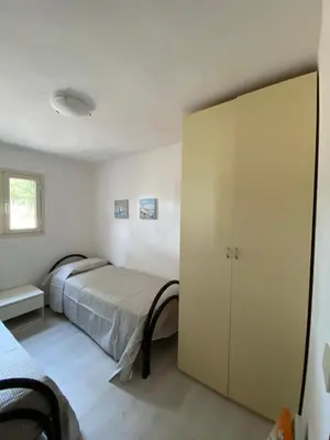 Letto o letti in una camera di Villa Gli Oleandri
