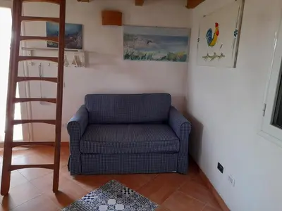 Area soggiorno di Casa vacanze in pineta vista mare