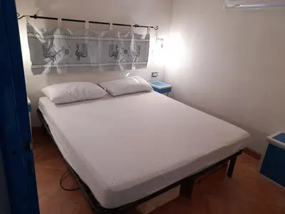Letto o letti in una camera di Casa vacanze in pineta vista mare