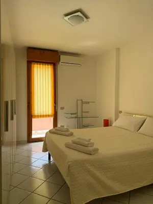 Letto o letti in una camera di Cagliari Home
