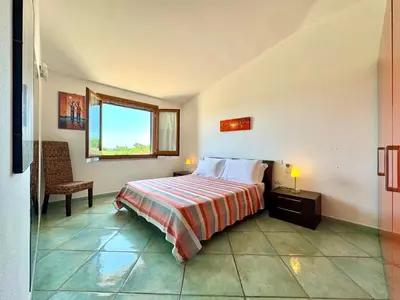 Letto o letti in una camera di Stardust Sea Apartments