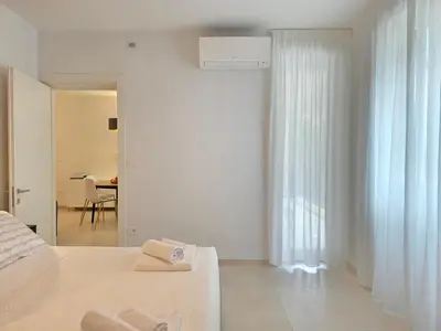 Letto o letti in una camera di UbiMaior Suite - Monte Urpinu apartment with parking