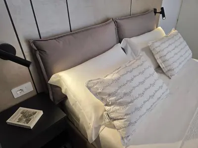 Letto o letti in una camera di UbiMaior Suite - Monte Urpinu apartment with parking