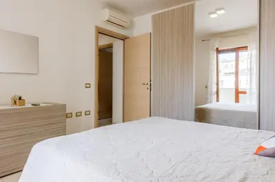 Letto o letti in una camera di GuestHost - Bright Apartment X4 with Terrace!