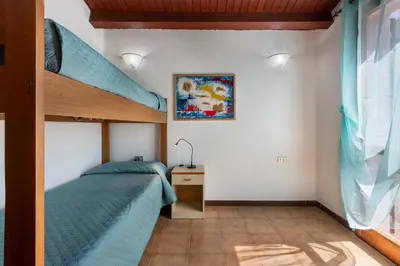 Letto o letti in una camera di GuestHost - Sea's Peace