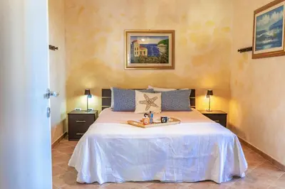 Letto o letti in una camera di Domo de Luxi - Calamenhir - Portoscuso