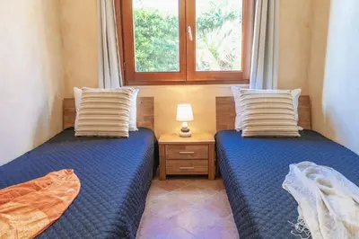 Letto o letti in una camera di Domo de Luxi - Calamenhir - Portoscuso
