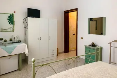 Letto o letti in una camera di Villa Gisa