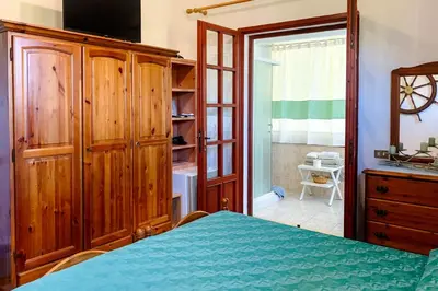 Letto o letti in una camera di Villa Gisa