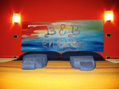 Letto o letti in una camera di Entula