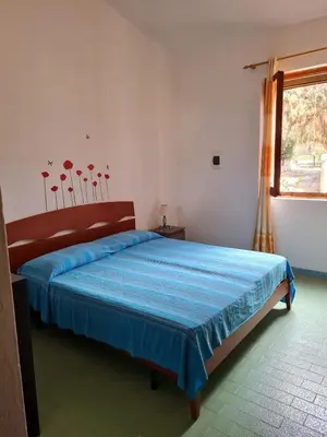 Letto o letti in una camera di Casa Notteri 2