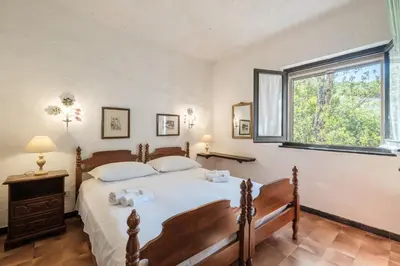 Letto o letti in una camera di Splendida villa nella natura a 200 m dal mare