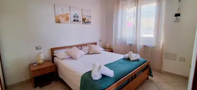 Letto o letti in una camera di Casa Silvana Relax e Mare nel cuore di Sant'Antioco